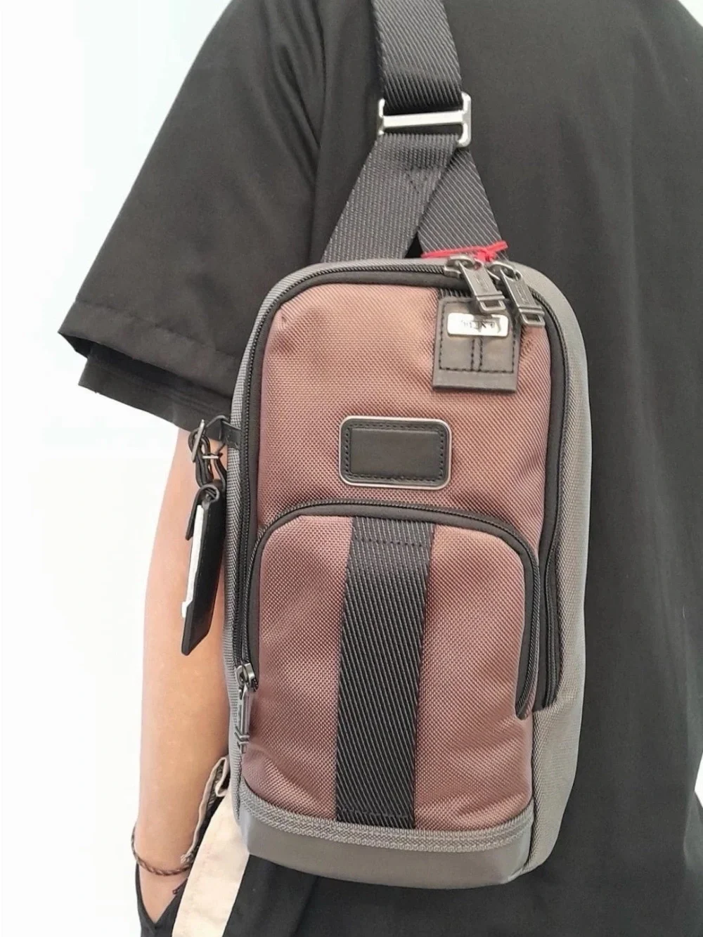 NWT Tumi FIFE Slim Sling Bag Copper and Black